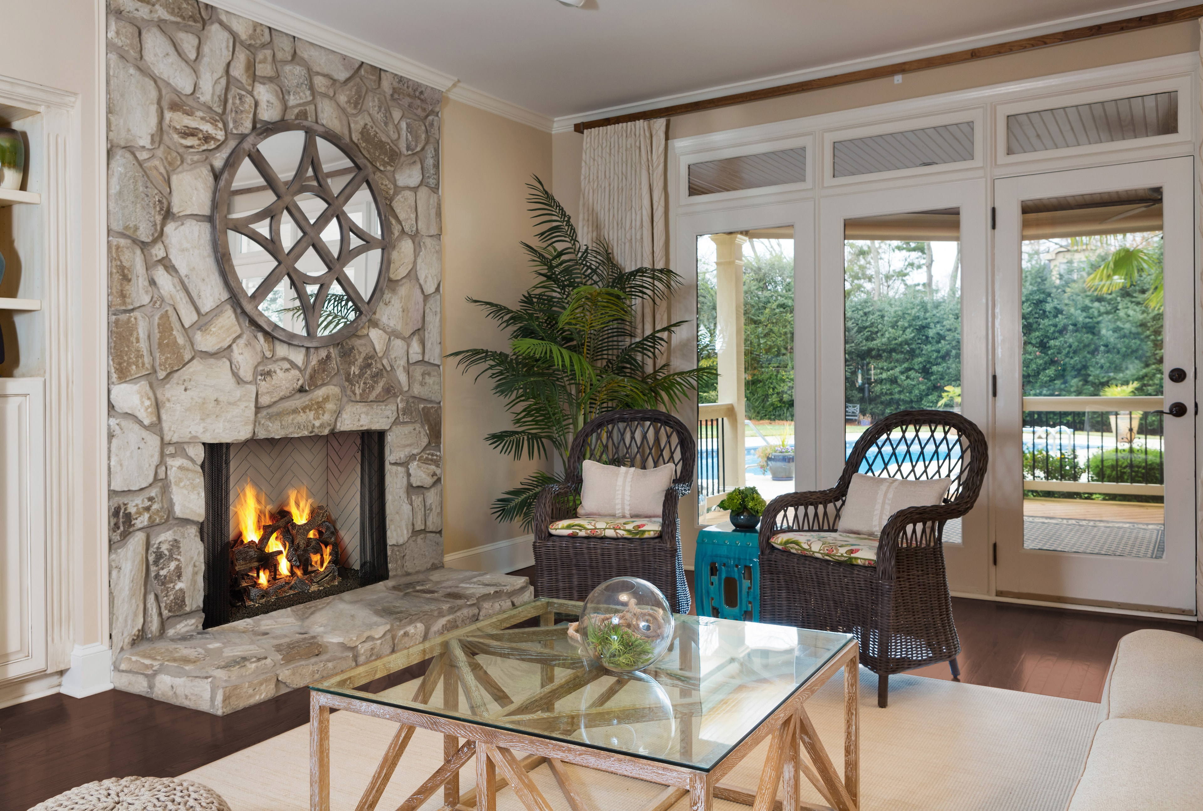 Majestic Ashland 36 gas fireplace in stone surround living room with pool view