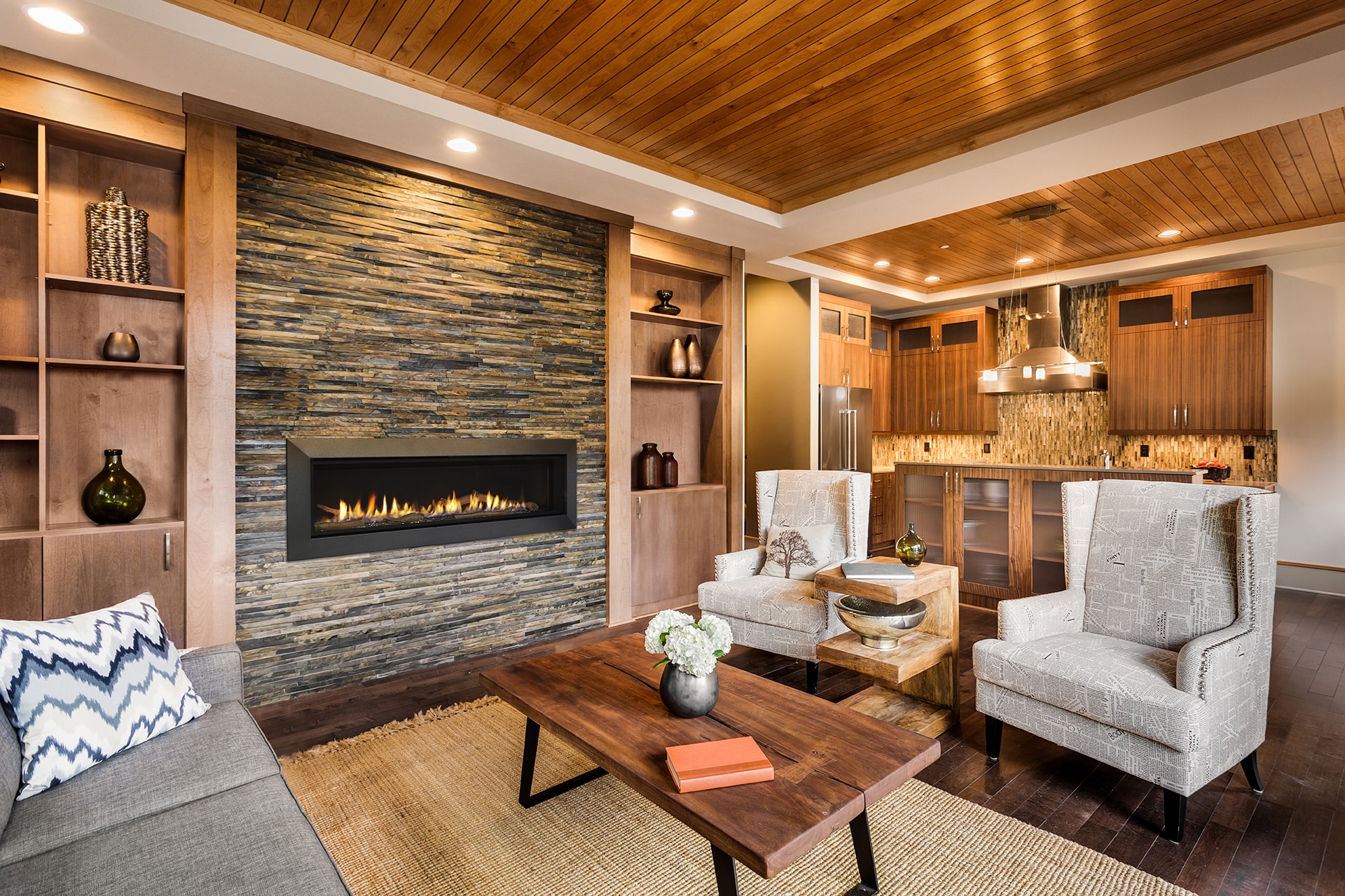 Majestic Echelon II 60 linear gas fireplace with warm wood ceiling and built-in shelving