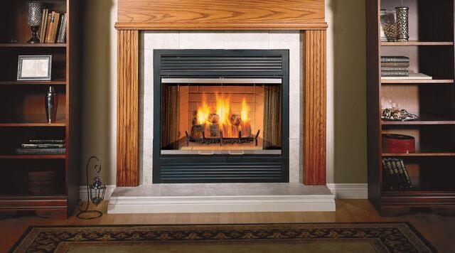 Majestic Sovereign wood-burning fireplace with oak surround and built-in bookshelves