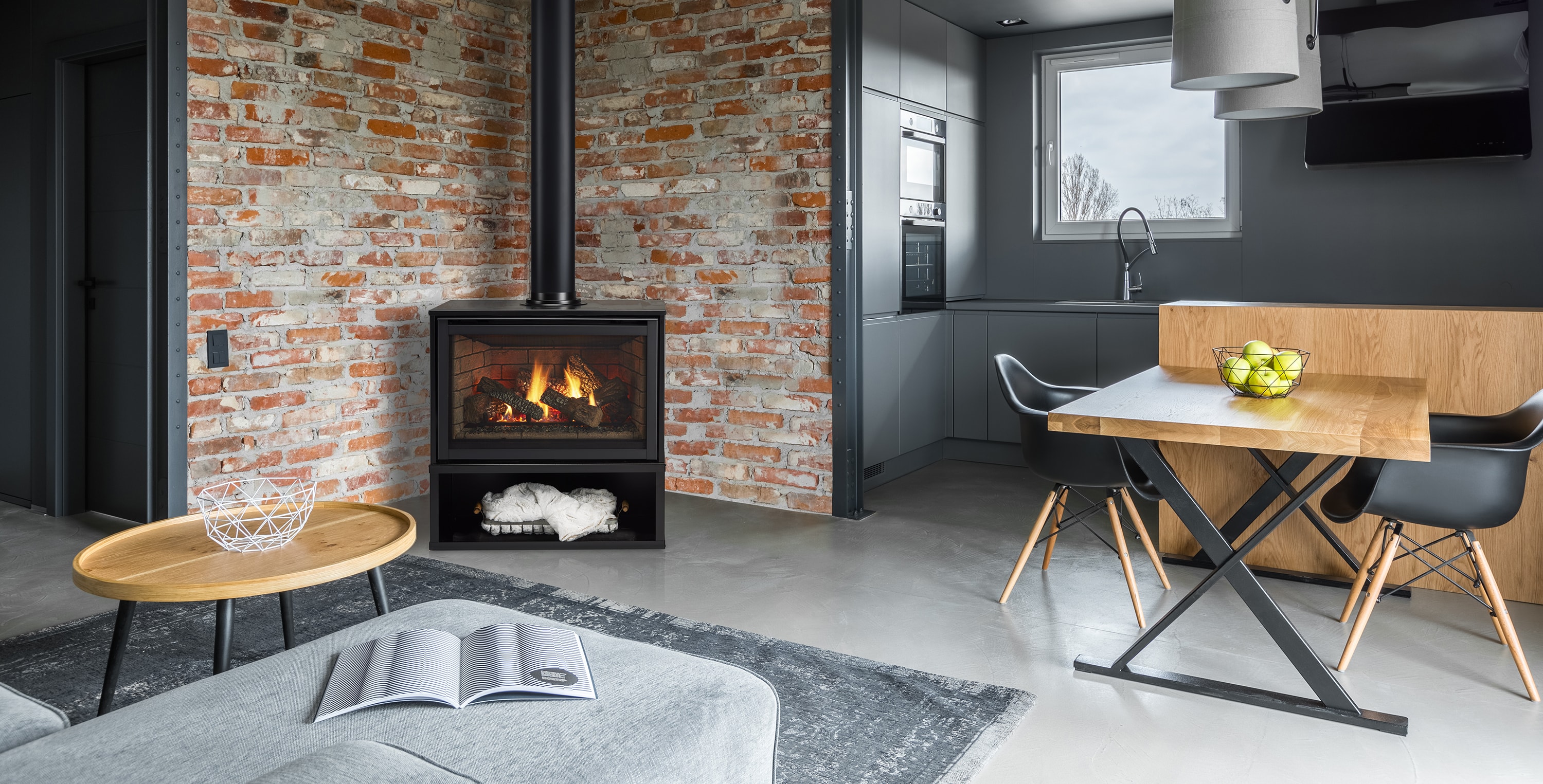 Majestic Trilliant freestanding gas stove in industrial loft with exposed brick